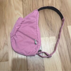 Pink Ameribag sling bag backpack with adjustable straps